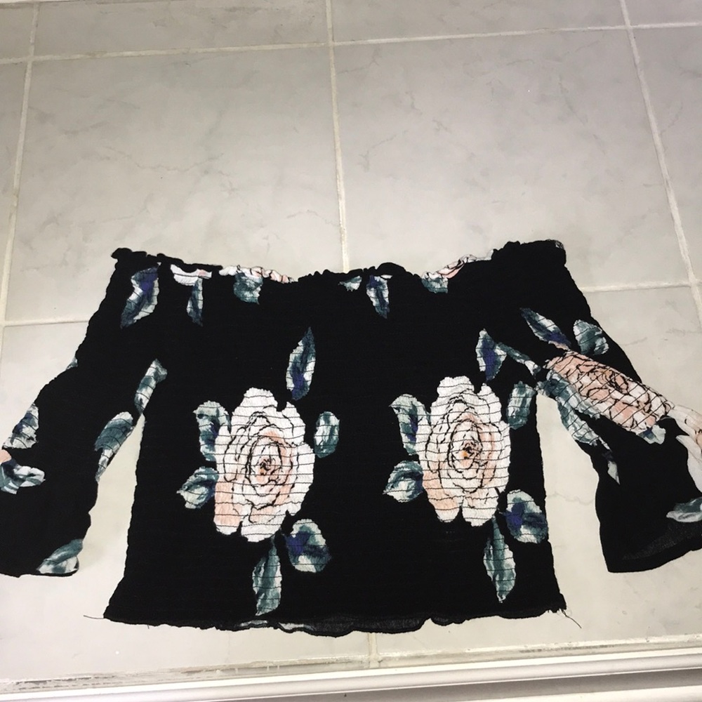 A off the shoulder black with flowers shirt!
